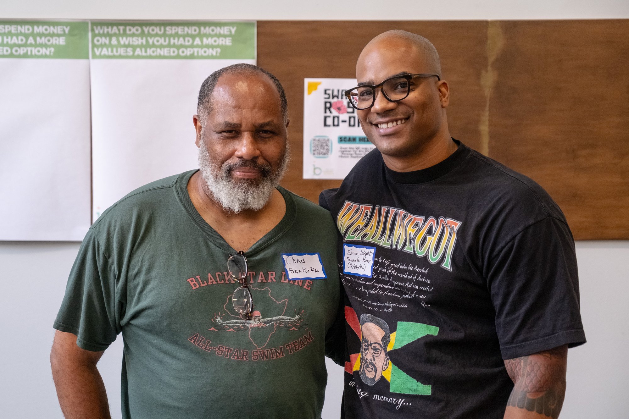 A photograph of two worker owners at Sankofa Bookstore and Cafe.